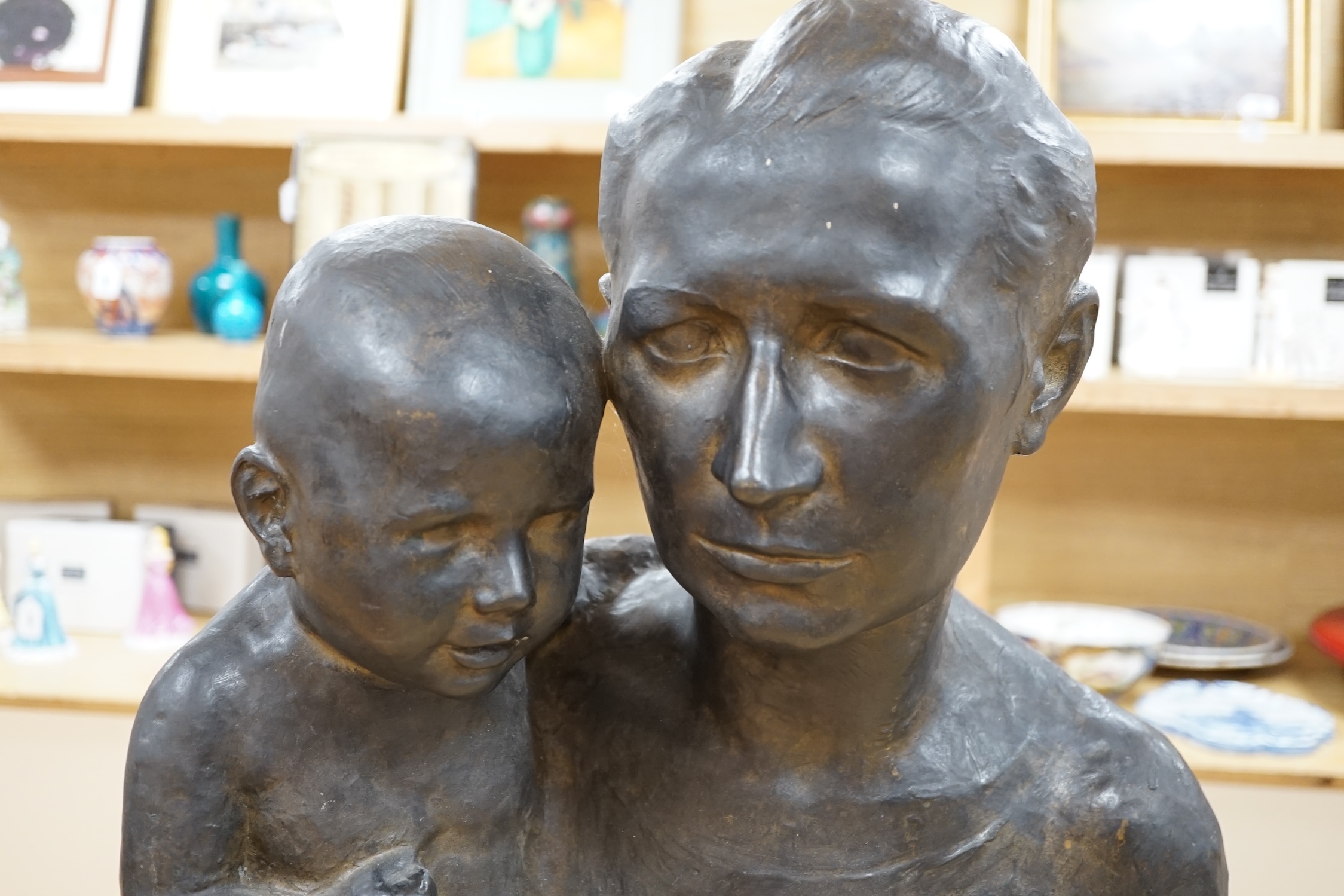 Turi Weinmann (German 1883-1950), a life size bronze bust of a mother and child, 73cm high. Condition - good